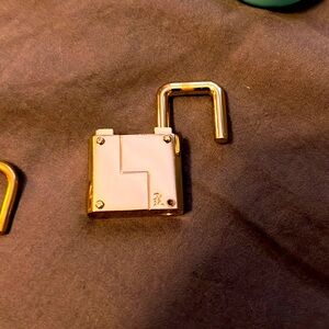 L.a.m.b lockable/ removal lock for her bags.